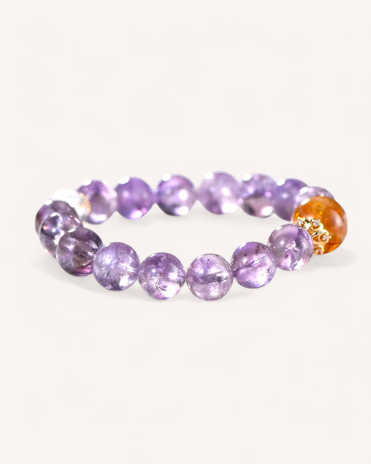 A top-down view of the Amethyst & Yellow Azeztulite Bracelet, showcasing its high-vibration crystals for abundance, intuition, and spiritual shielding.