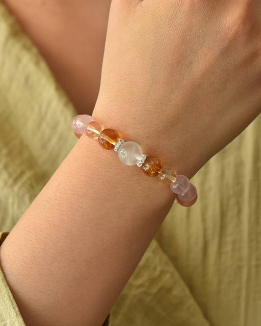 Woman wearing the Multicolor Lotus Serenity Bracelet, designed for chakra healing, emotional balance, and energy alignment.
