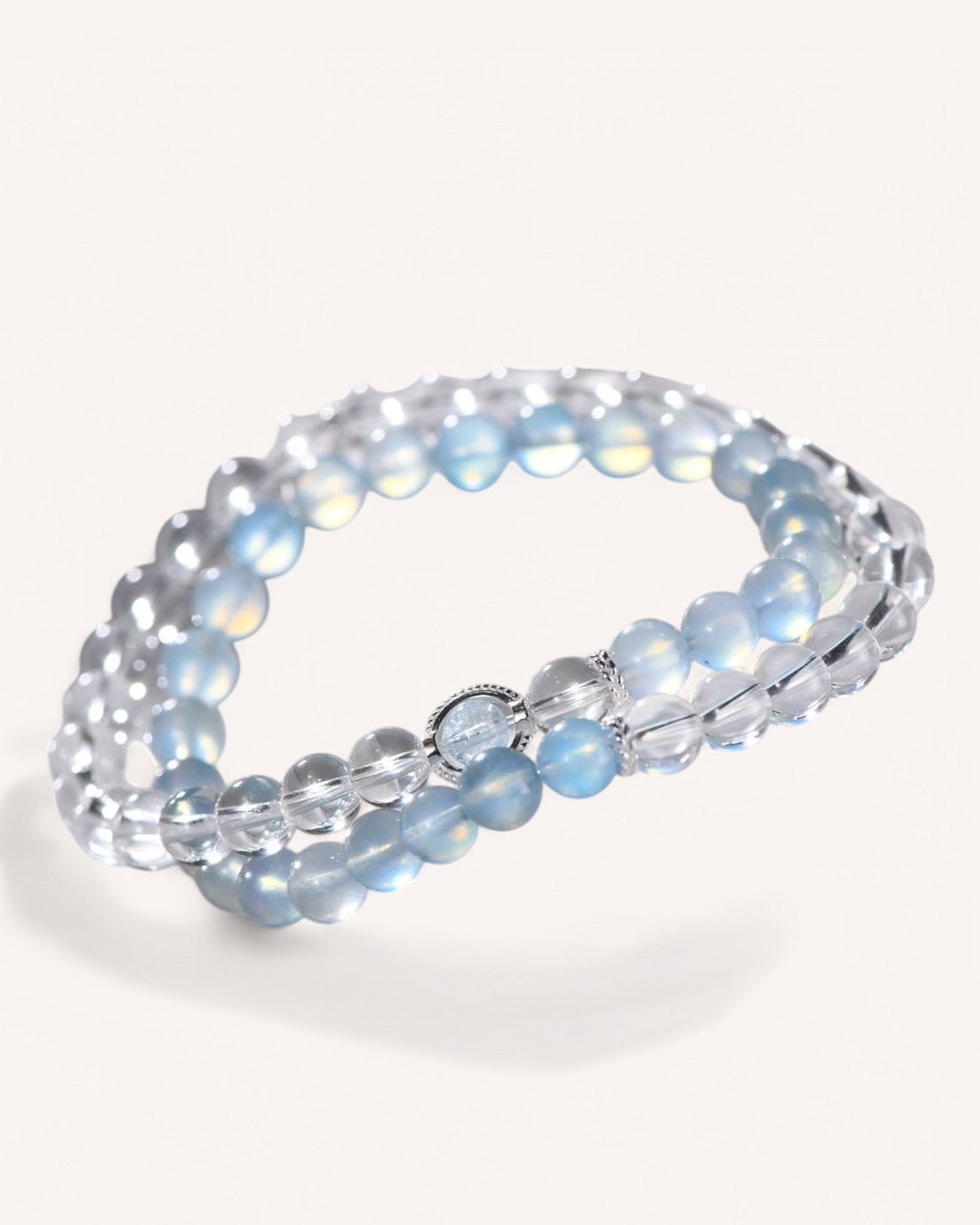 A multi-layer White Quartz & Aquamarine bracelet, crafted to reduce stress, enhance relaxation, and improve mental clarity. The deep blue hues of aquamarine symbolize ocean energy, emotional healing, and mindfulness.