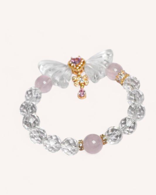 A delicate White Quartz and Rose Quartz bracelet featuring a butterfly charm, symbolizing transformation, emotional healing, and self-love. Perfect for balance, positivity, and renewal.