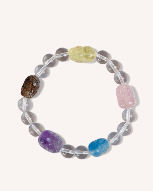A beautifully crafted White Quartz and multicolor gemstone bracelet featuring Aquamarine, Rose Quartz, Citrine, Amethyst, and Smoky Quartz. Designed to enhance emotional balance, clarity, and creativity while promoting prosperity and inner peace