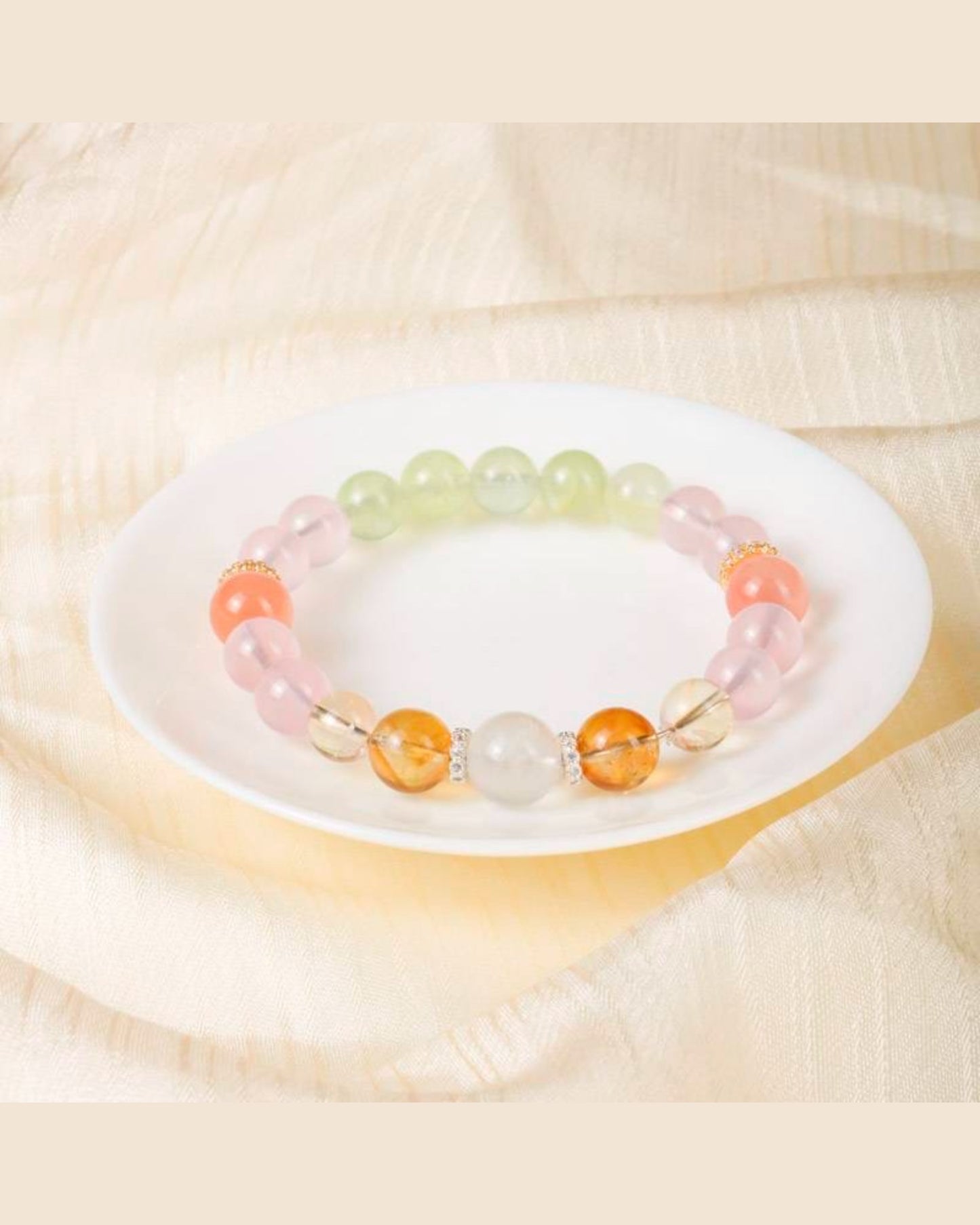 Multicolor Lotus Serenity Bracelet placed on a white dish, showcasing natural healing crystals for emotional well-being and transformation.