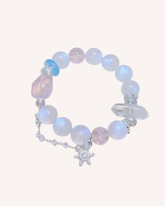Emotional healing crystal bracelet with Moonstone, Aquamarine, and Rose Quartz on white background
