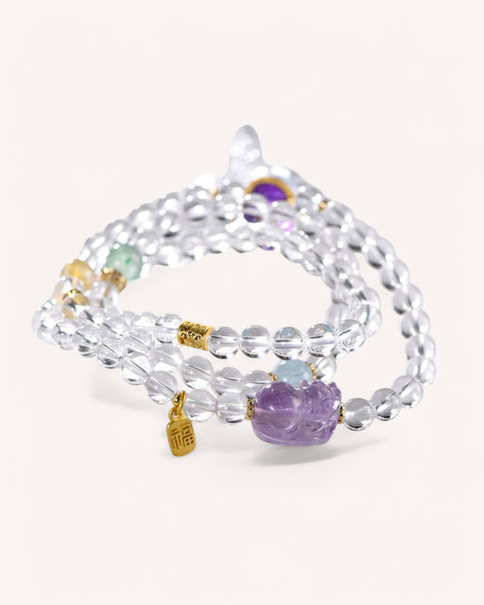 Elegant White Quartz multi-layer bracelet adorned with Rutilated Quartz, Amethyst, and Aquamarine for spiritual alignment, energy purification, and prosperity attraction.