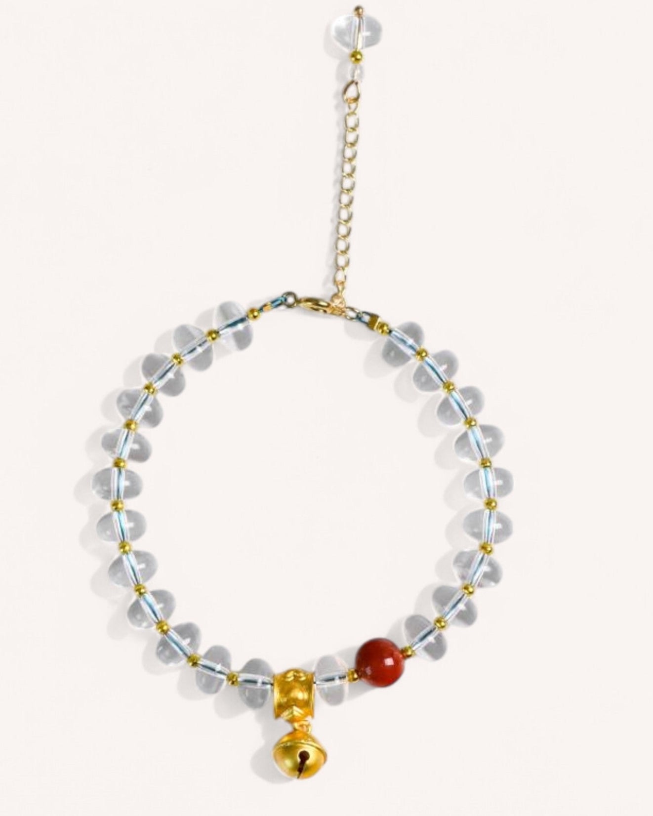 Side view of a double-layered white quartz bracelet featuring red coral accents, designed to enhance spiritual cleansing, luck, and positive energy.