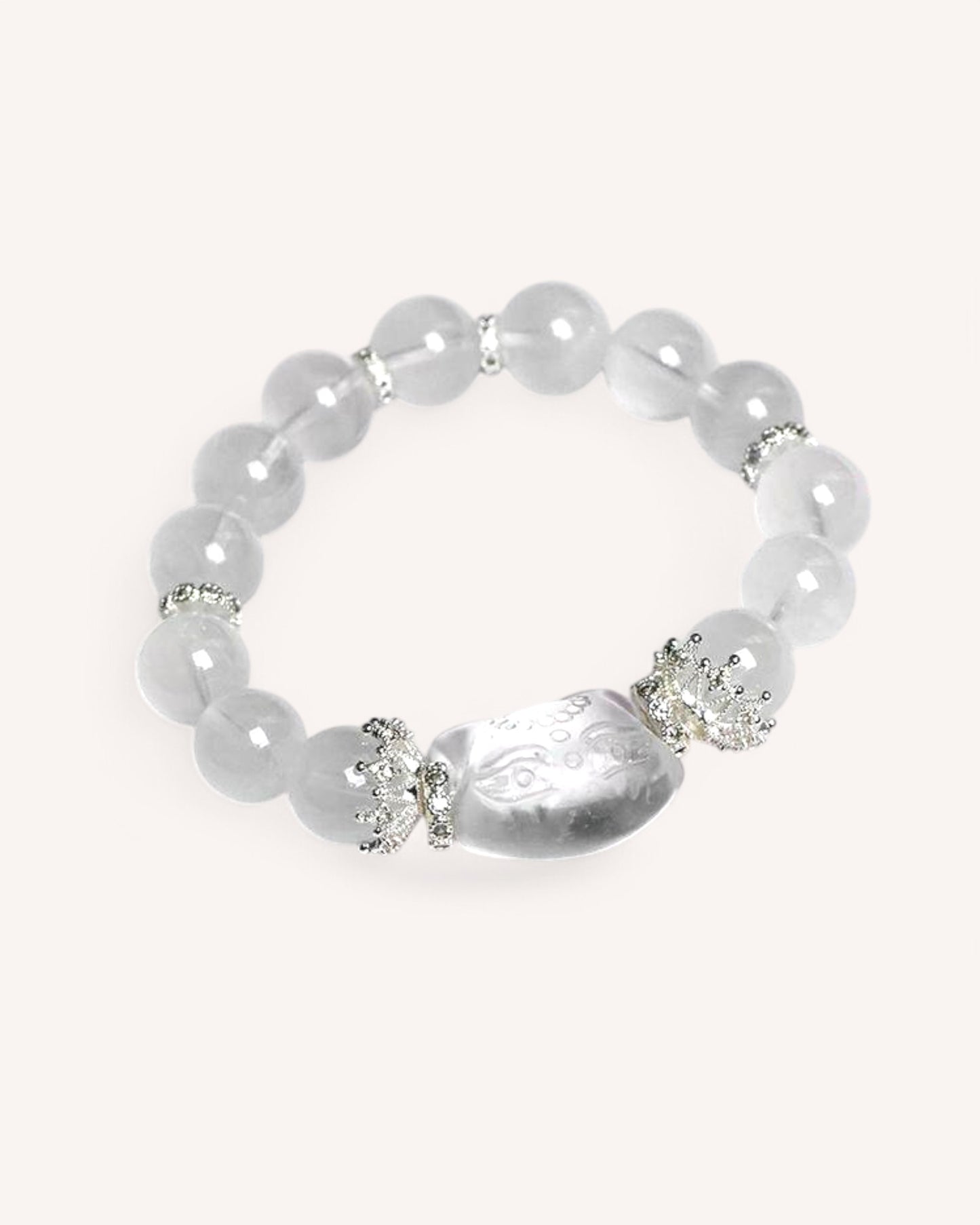 Elegant White Phantom Quartz healing bracelet with smooth white beads and a spiritual charm, enhancing focus and intuition.