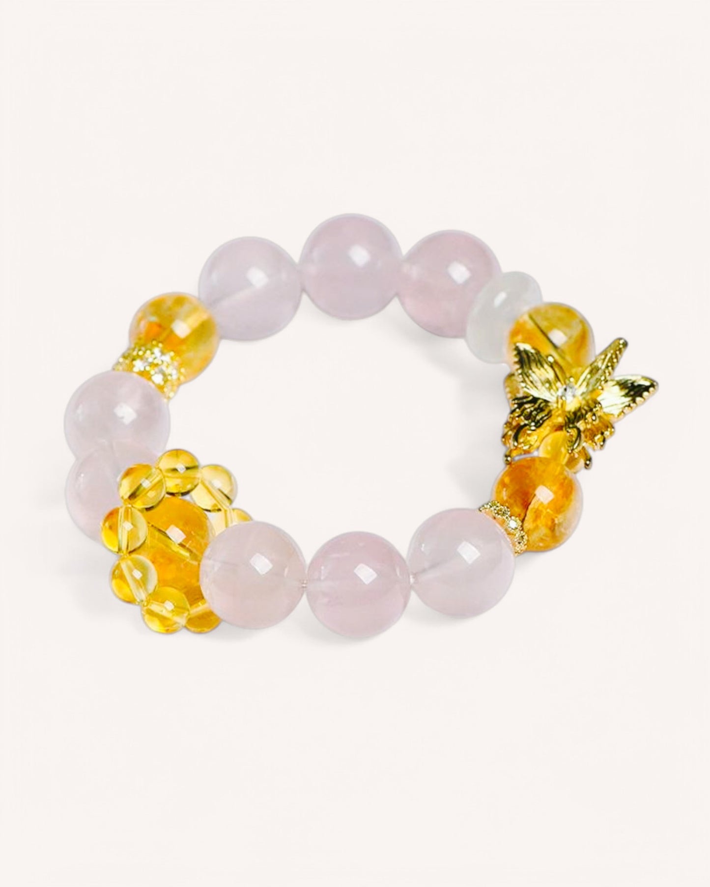 Front view of Rose Quartz and Yellow Azeztulite bracelet with gold butterfly charm, designed for abundance, confidence, love, and emotional healing.