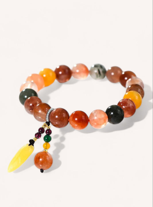 Side angle of prosperity bracelet featuring Amber and Fortune Longevity Quartz for energy and confidence