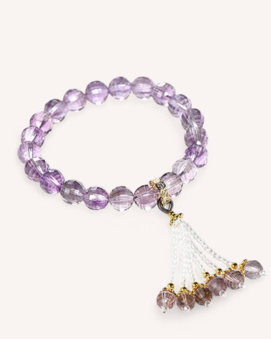 High-quality amethyst crystal bracelet with flowing tassel, designed for spiritual protection, emotional stability, and enhanced intuition.