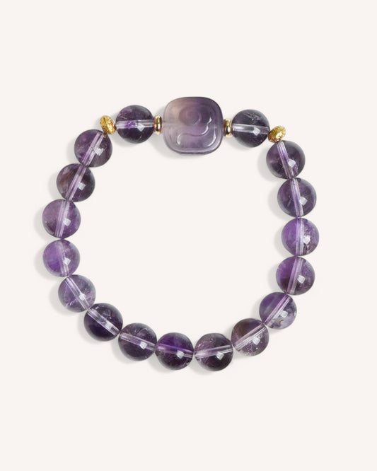Elegant Amethyst Healing Energy Bracelet with a unique carved centerpiece, promoting clarity, intuition, and spiritual awareness.