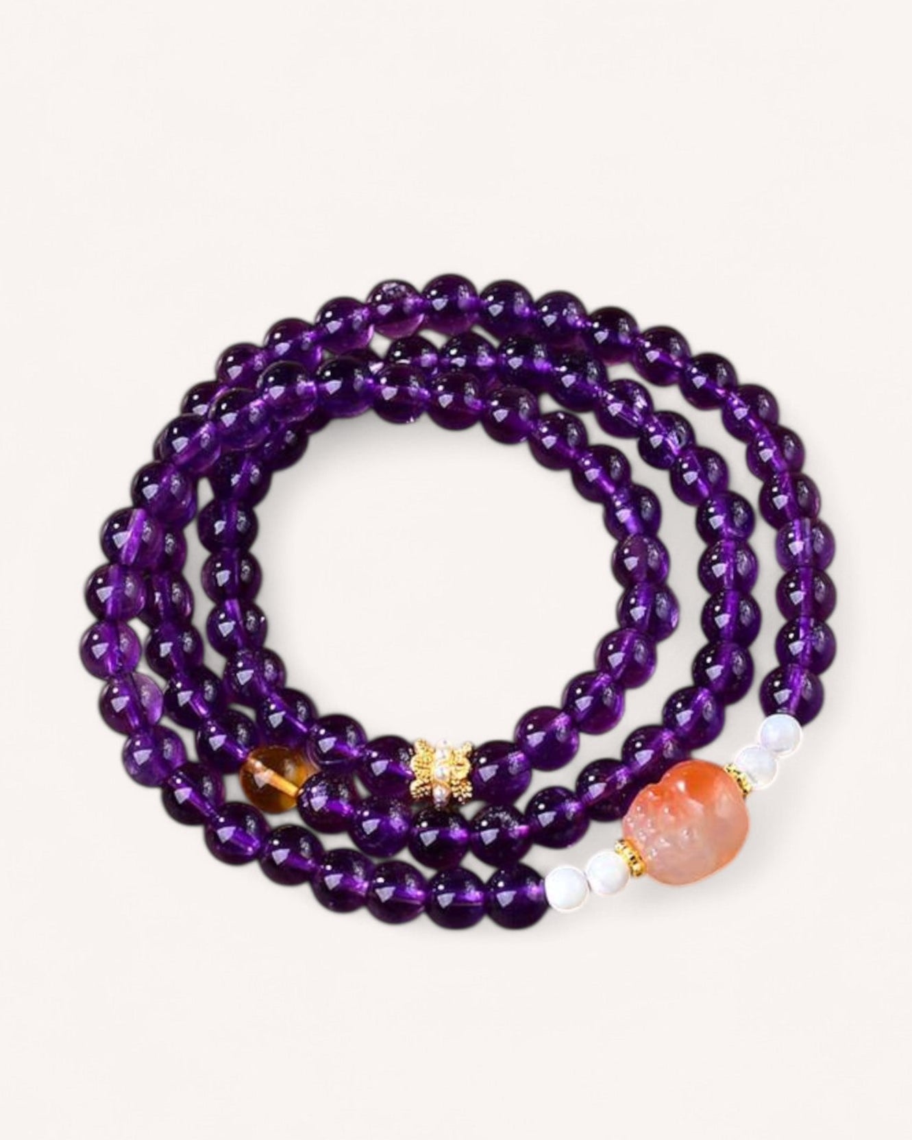 Triple-wrap Amethyst and Sunstone bracelet for spiritual protection, energy balance, and positivity. Features deep violet Amethyst and warm Sunstone for intuition and strength.