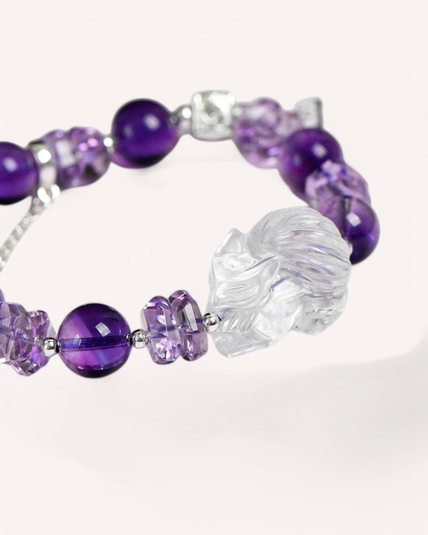 Side angle of the Amethyst & White Quartz Guardian Fox Bracelet, showcasing its intricate fox charm, floral amethyst beads, and white quartz elements for energy shielding and wisdom enhancement.