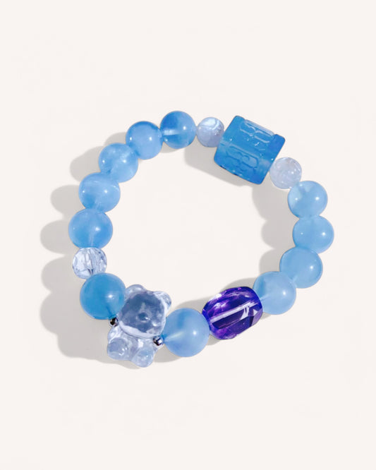 Model wearing aquamarine and mixed crystal bracelet for emotional healing and spiritual clarity