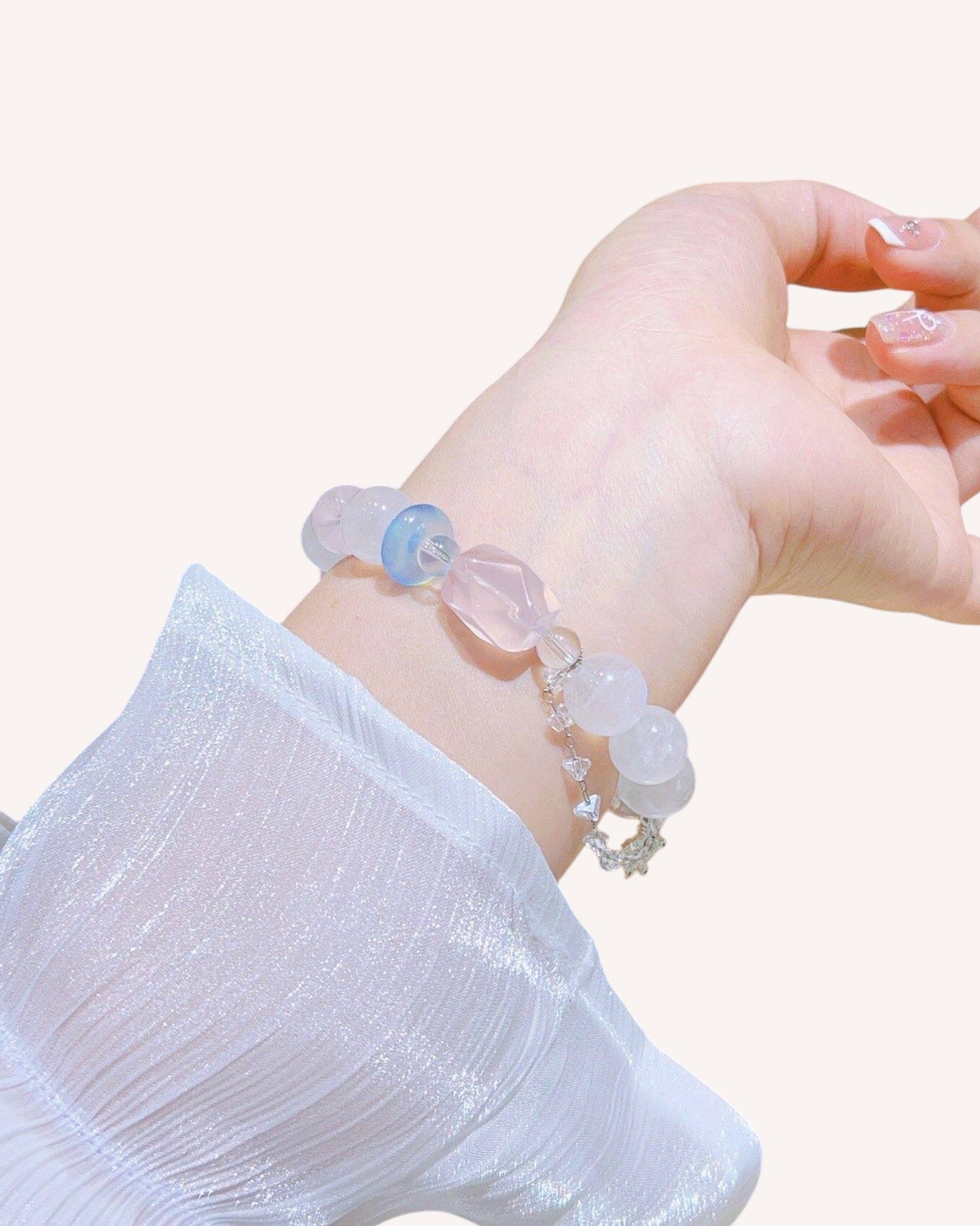 Top view of Aquamarine and Moonstone crystal bracelet for emotional healing on wrist