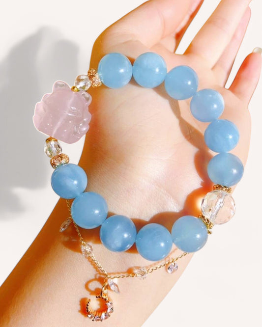 Aquamarine and rose quartz fox spirit bracelet worn on wrist for love, protection and inner peace