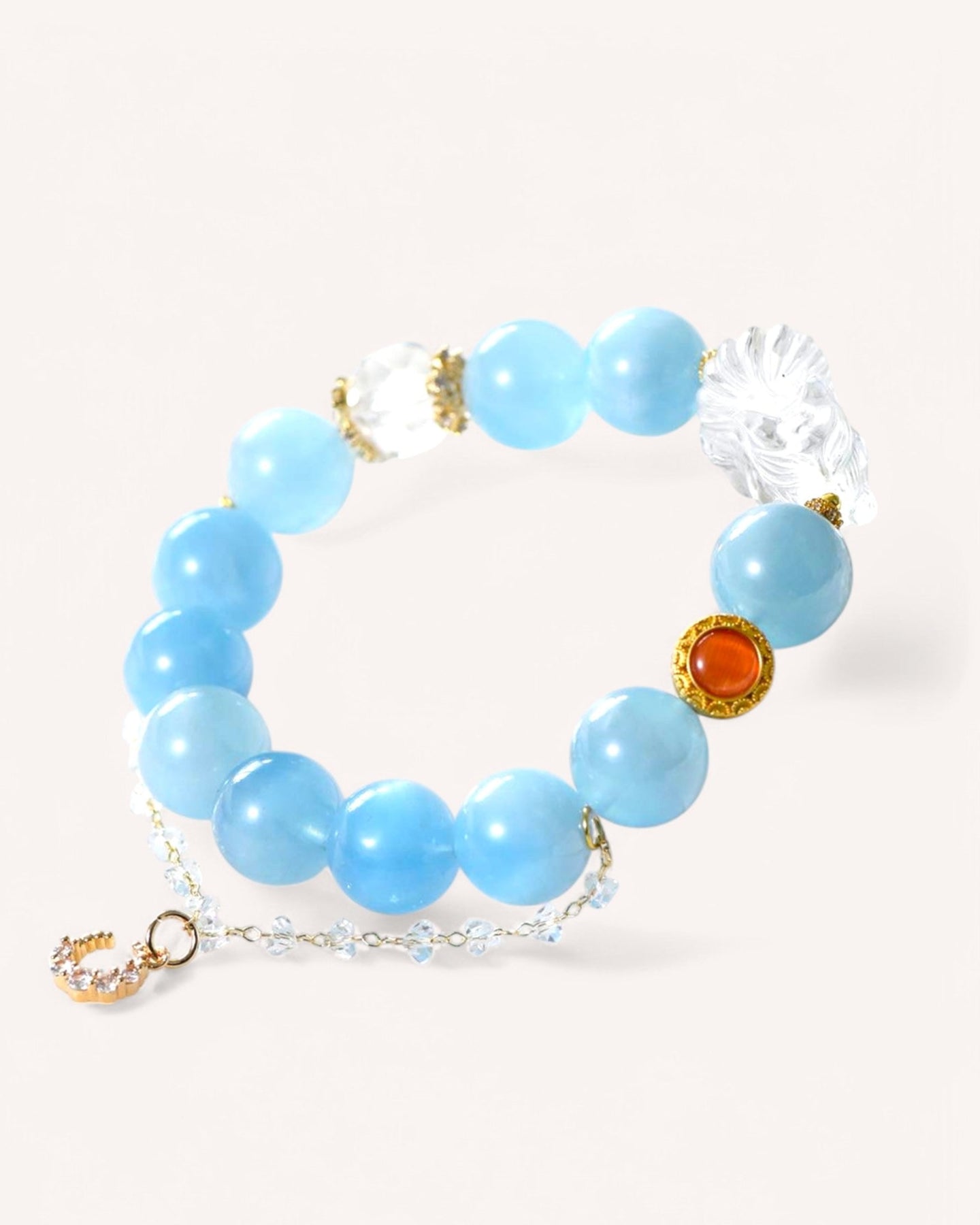 Aquamarine and white quartz healing bracelet with golden accents and amber bead for emotional healing, clarity, and protection