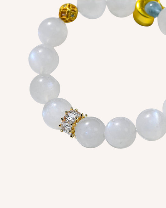 Side angle of Blue Glow White Moonstone bracelet showing glowing bead for intuition, spiritual protection, and feminine energy