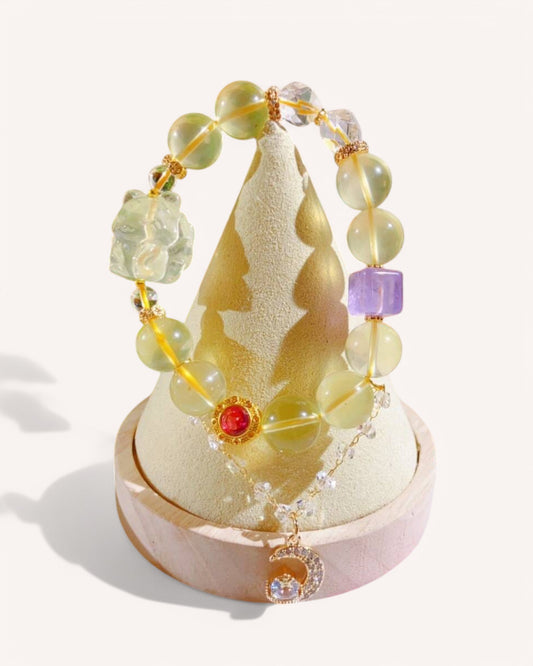 Citrine & Amethyst Energy Bracelet Display – Showcased elegantly with a crystal decor, this bracelet blends Citrine for optimism, White Quartz for clarity, and Lavender Amethyst for intuition, making it an ideal spiritual healing accessory.
