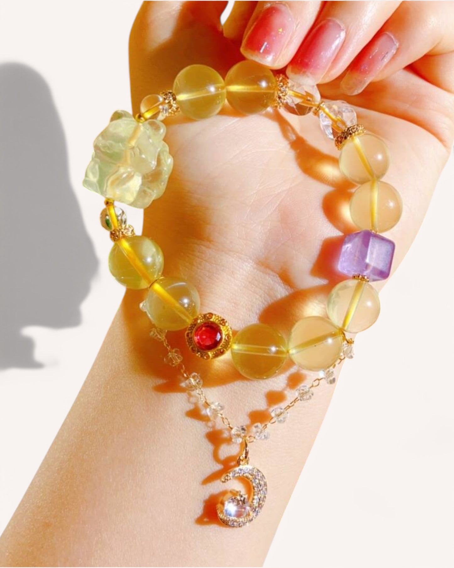 Citrine & Amethyst Spiritual Bracelet on Wrist – A handcrafted crystal bracelet featuring Citrine, White Quartz, and Lavender Amethyst. Designed to enhance wisdom, positivity, and emotional balance, perfect for manifestation and self-discovery.