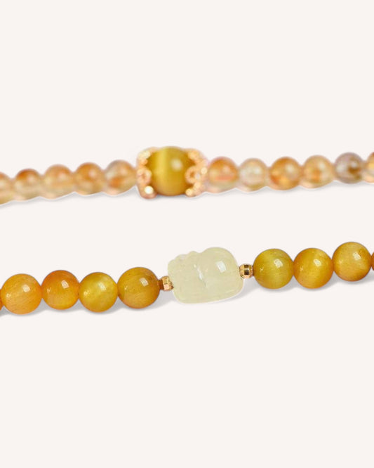 Citrine & Tiger Eye Pi Xiu Energy Bracelet – A powerful wealth and protection bracelet featuring natural Citrine and Golden Tiger Eye beads, accented with a Pi Xiu charm to amplify financial success and personal strength.