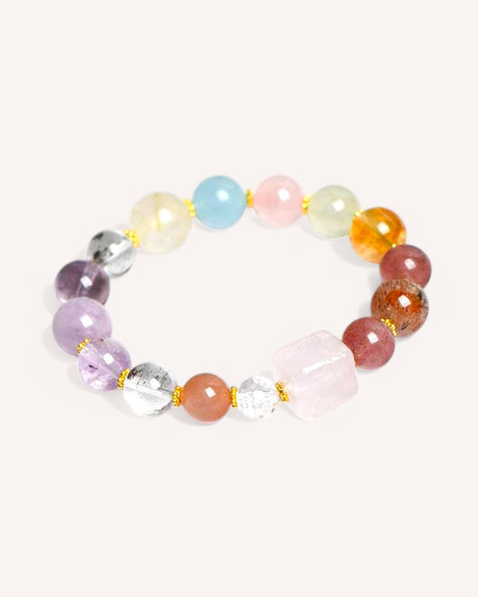 Colorful natural crystal bracelet featuring Super Seven, Aquamarine, and Rose Quartz for spiritual growth and positive energy