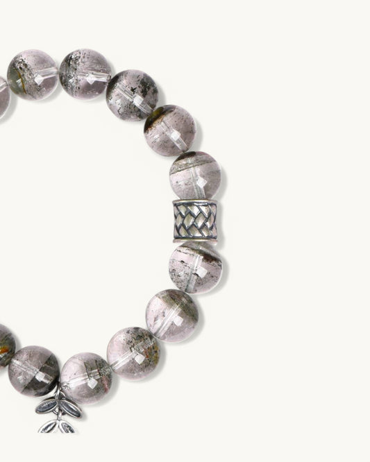 Side view of Green Phantom Quartz bracelet with silver accents, designed for stability and spiritual clarity.