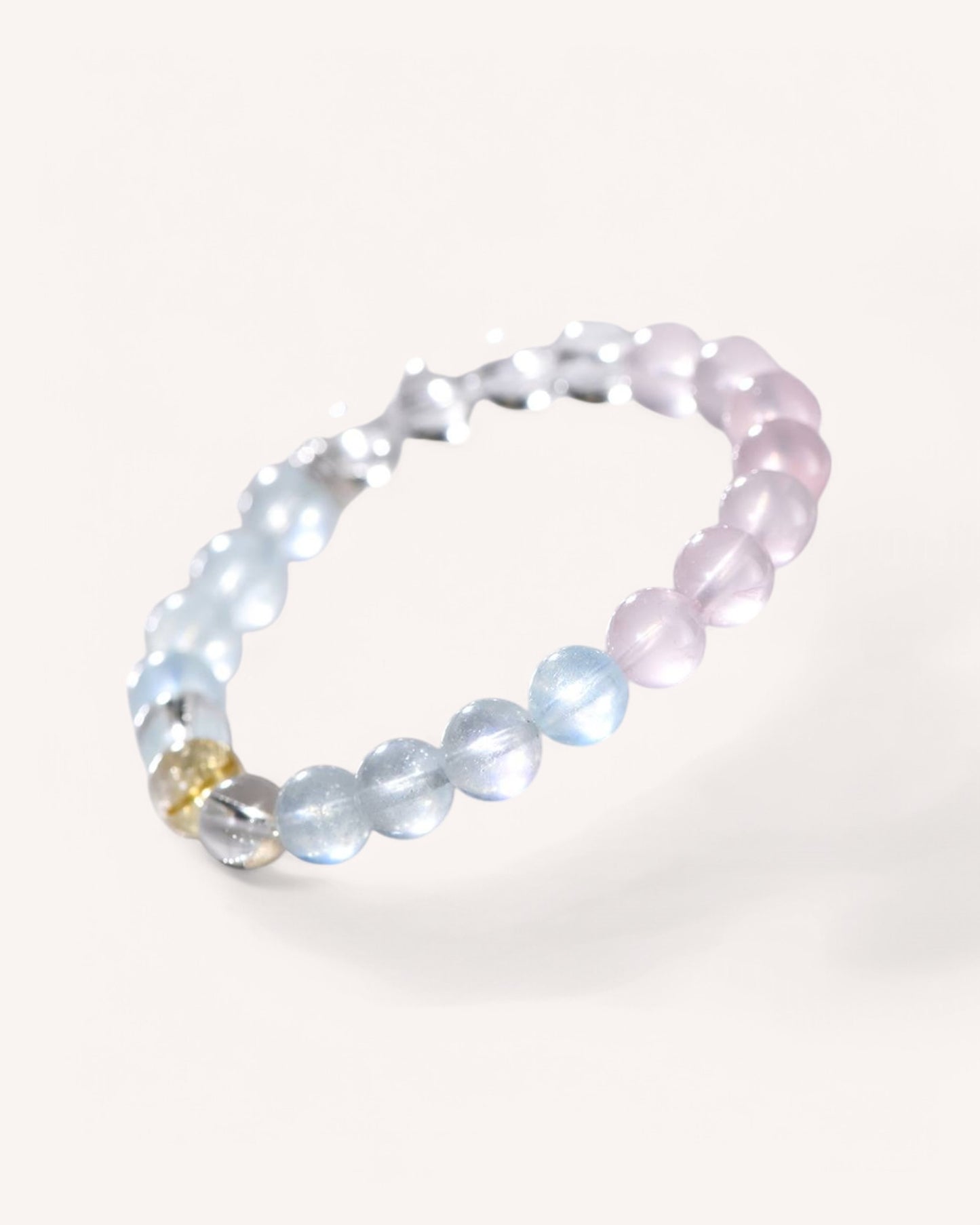 A stunning White Quartz, Rose Quartz, Aquamarine, and Yellow Quartz Bracelet, crafted to enhance emotional clarity, self-love, and spiritual balance. Ideal for energy purification and inner peace.