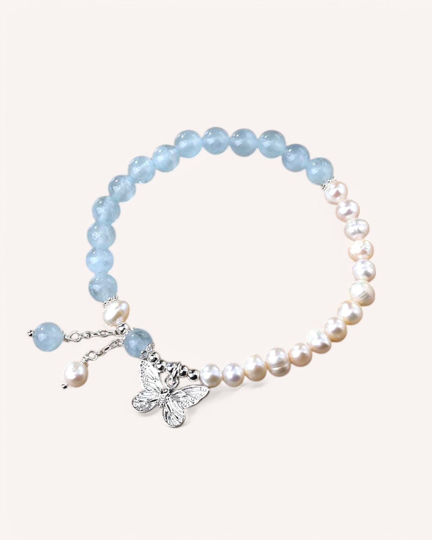 Elegant Aquamarine and Pearl bracelet with butterfly charm for emotional healing and clarity