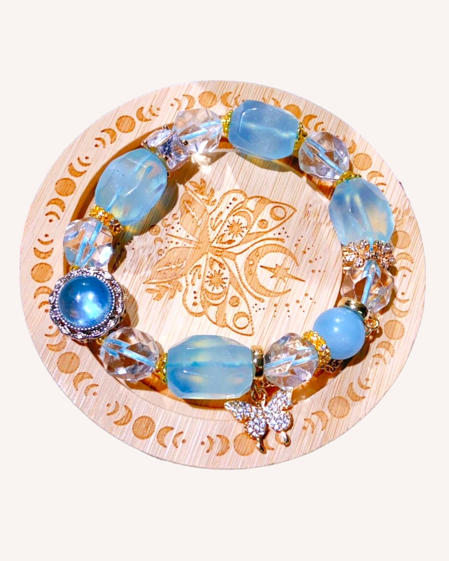 Flatlay view of aquamarine and white quartz bracelet designed for emotional healing and stress relief