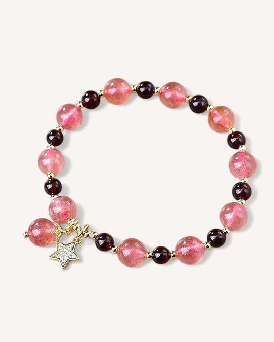 Close-up of Strawberry Quartz & Garnet bracelet featuring gold alloy star charm, enhancing love and vitality