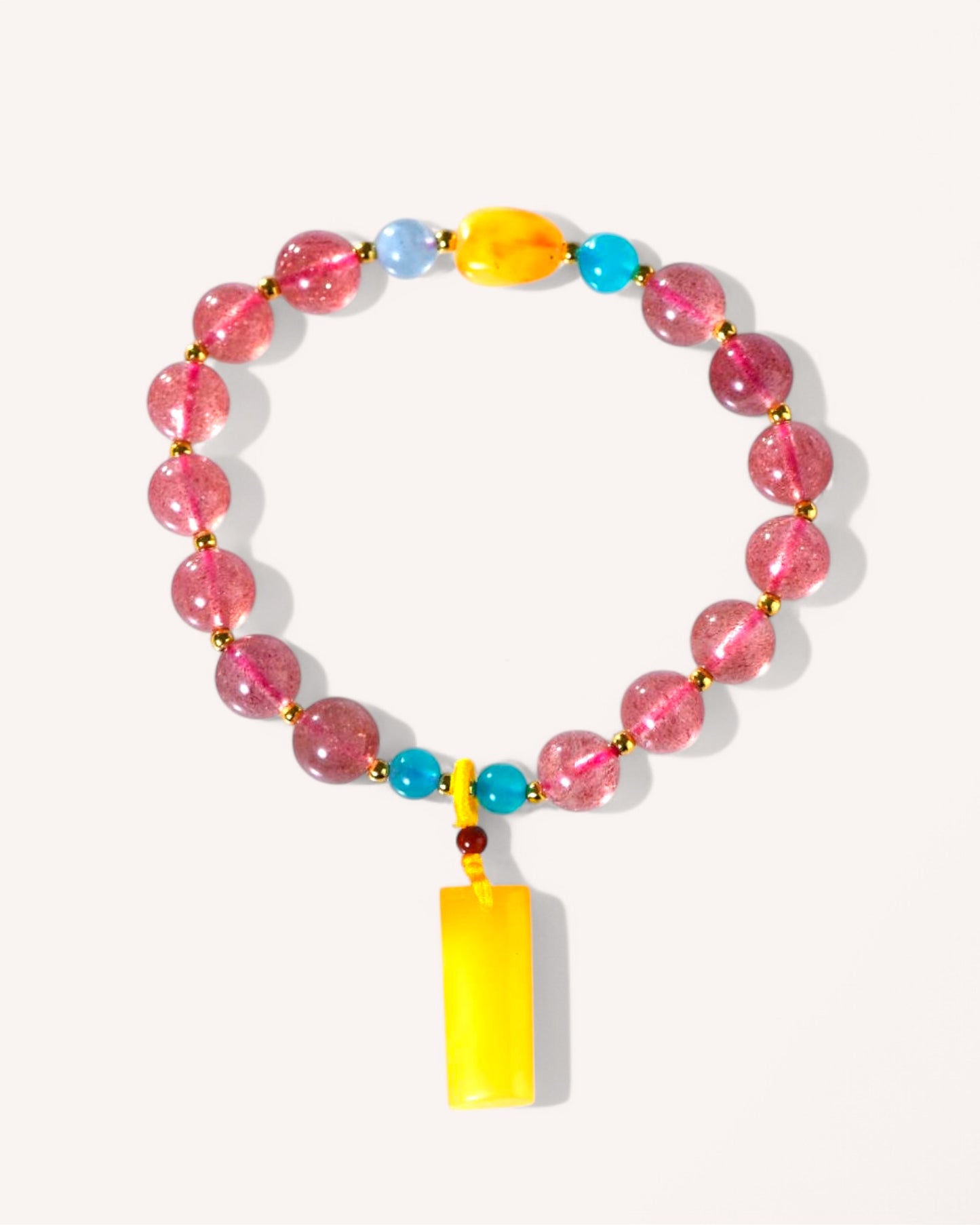 Healing bracelet featuring Strawberry Quartz, Amber, Aquamarine, and Amazonite crystals for emotional balance, spiritual protection, and love energy.