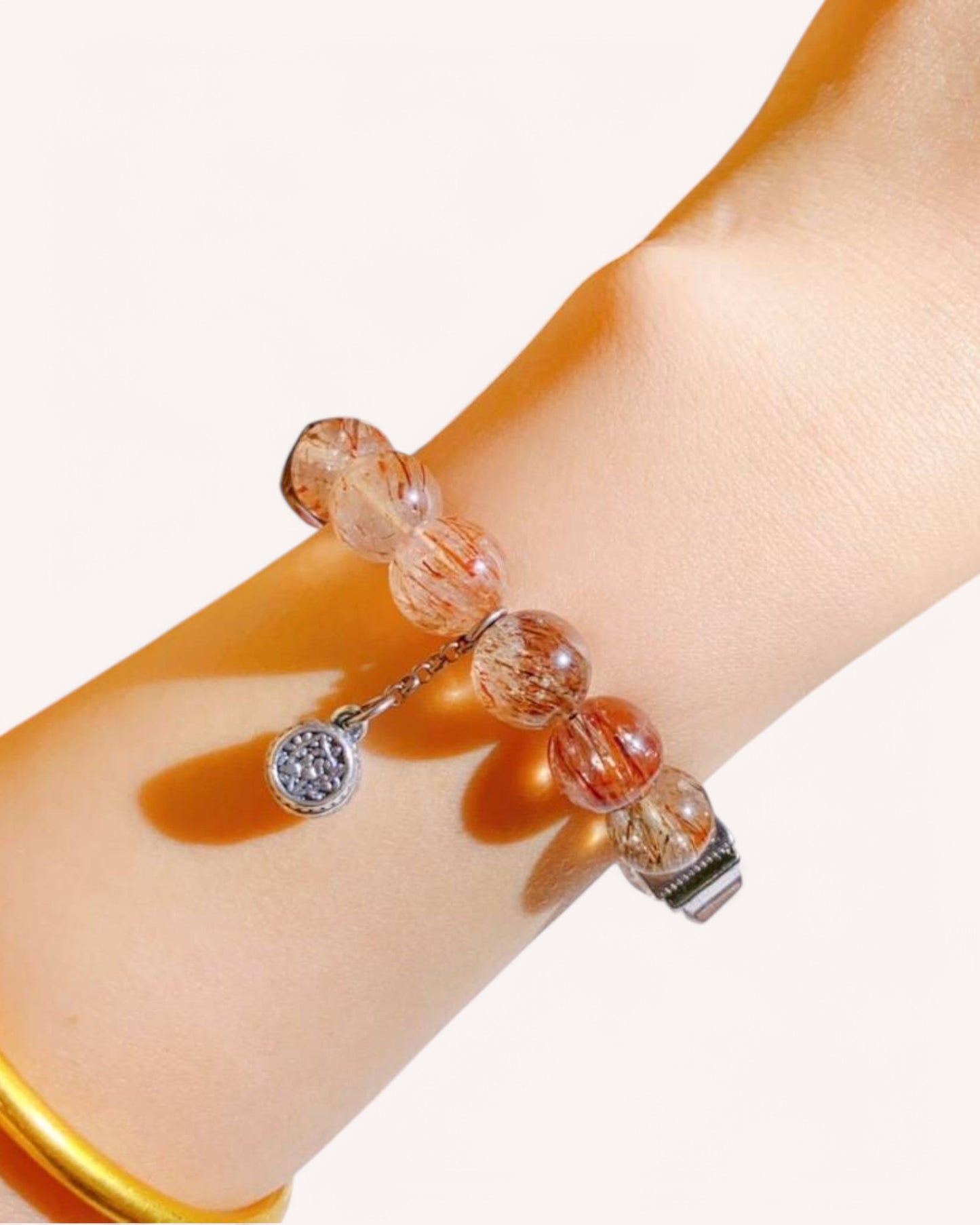 Elegant bracelet worn on wrist showcasing Super Seven and Black Rutilated Quartz for energy protection and wealth