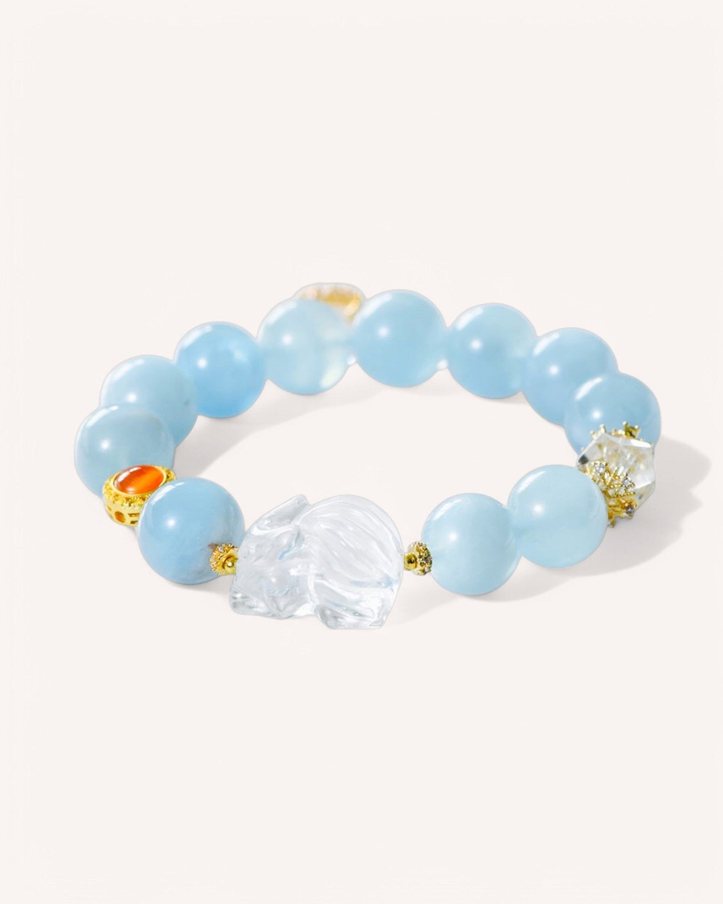 Healing gemstone bracelet featuring aquamarine, white quartz, and gold details for balance and emotional clarity