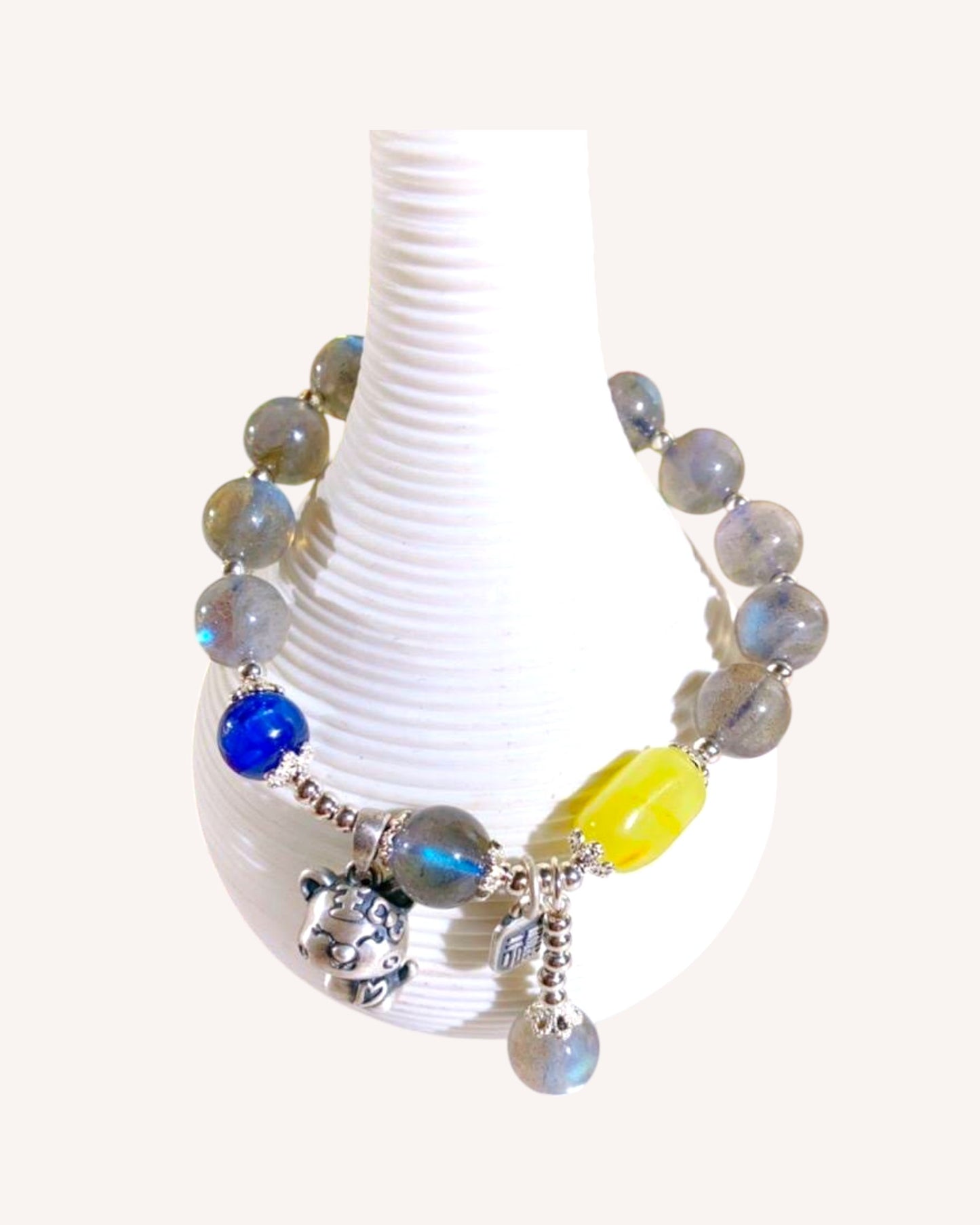 Front view of Kyanite, Blue Moonstone, and Amber healing bracelet with S999 silver charms for emotional clarity and spiritual balance.