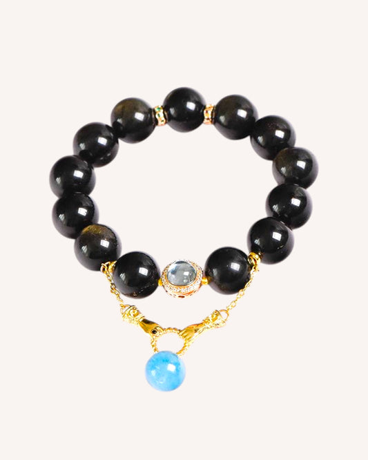 Close-up of Golden Rutilated Quartz and Aquamarine bracelet designed to attract abundance and enhance clarity