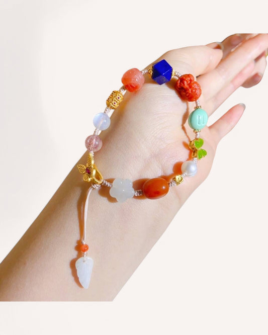Healing crystal bracelet with mantra charm, jade, and turquoise shown worn on wrist for emotional balance and abundance