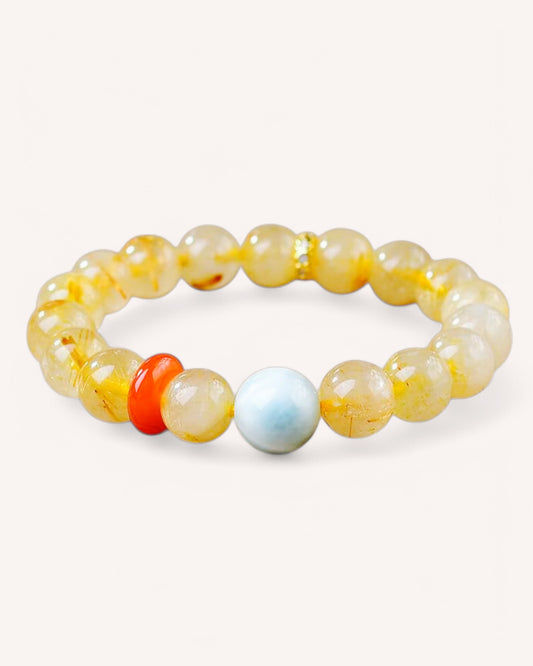 Angle view of prosperity bracelet with Larimar, Rutilated Quartz, and South Red Agate stones for emotional balance and abundance.