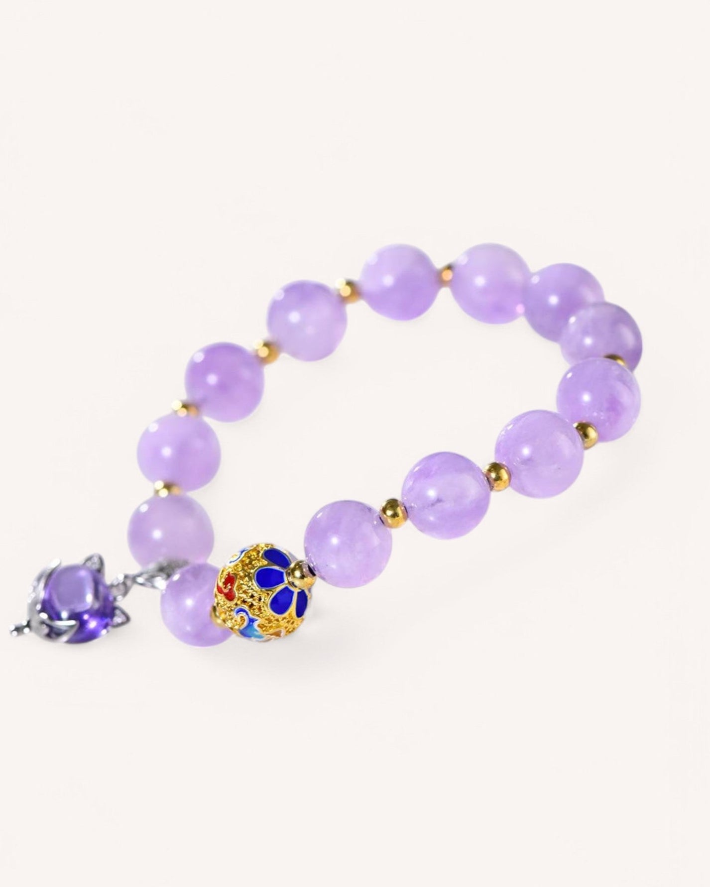 Lavender Amethyst Fox Spirit Guardian Bracelet featuring a mystical fox charm and gold-accented beads, designed for intuition, wisdom, and energy protection.
