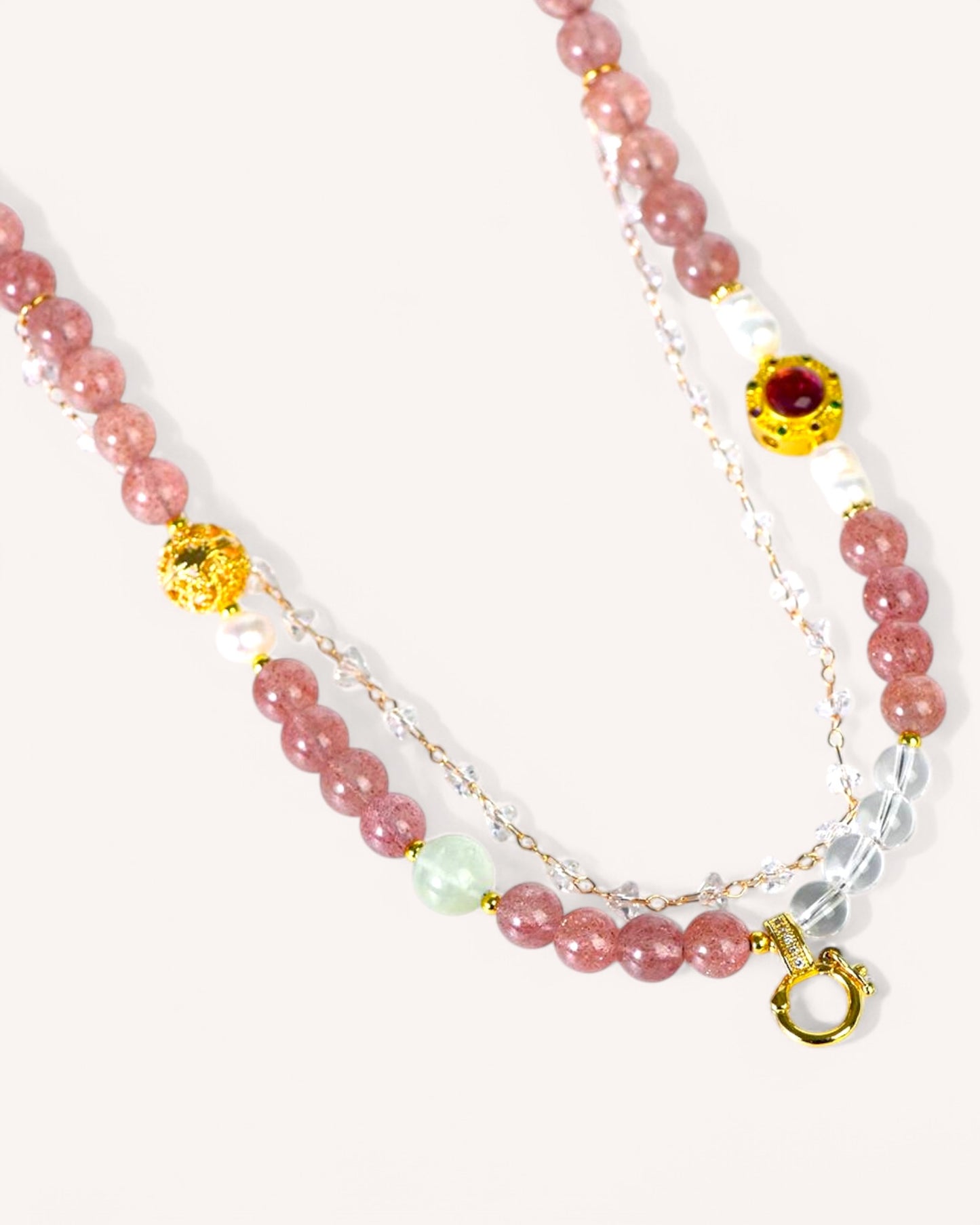 Close-up of multi-way crystal bracelet necklace featuring Strawberry Quartz, White Quartz, and Grape Agate for love, clarity, and healing.