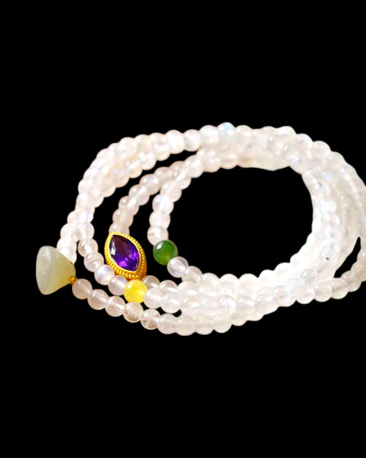 Multi-layer healing bracelet made with Moonstone, Natural Amber, and Hetian Jade for emotional balance and spiritual protection.