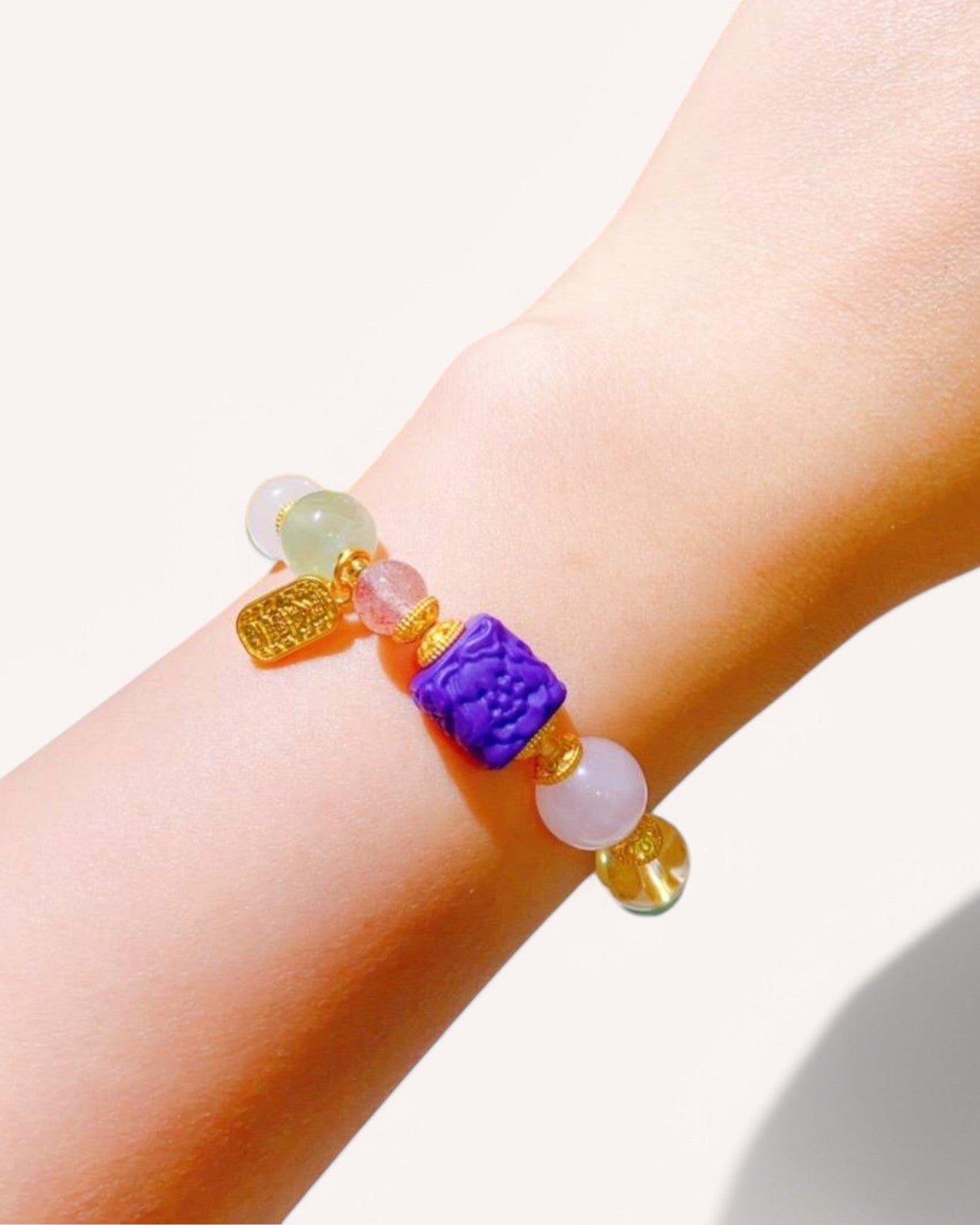 Woman wearing a multi-gemstone healing bracelet for emotional stability, intuition, and divine energy flow