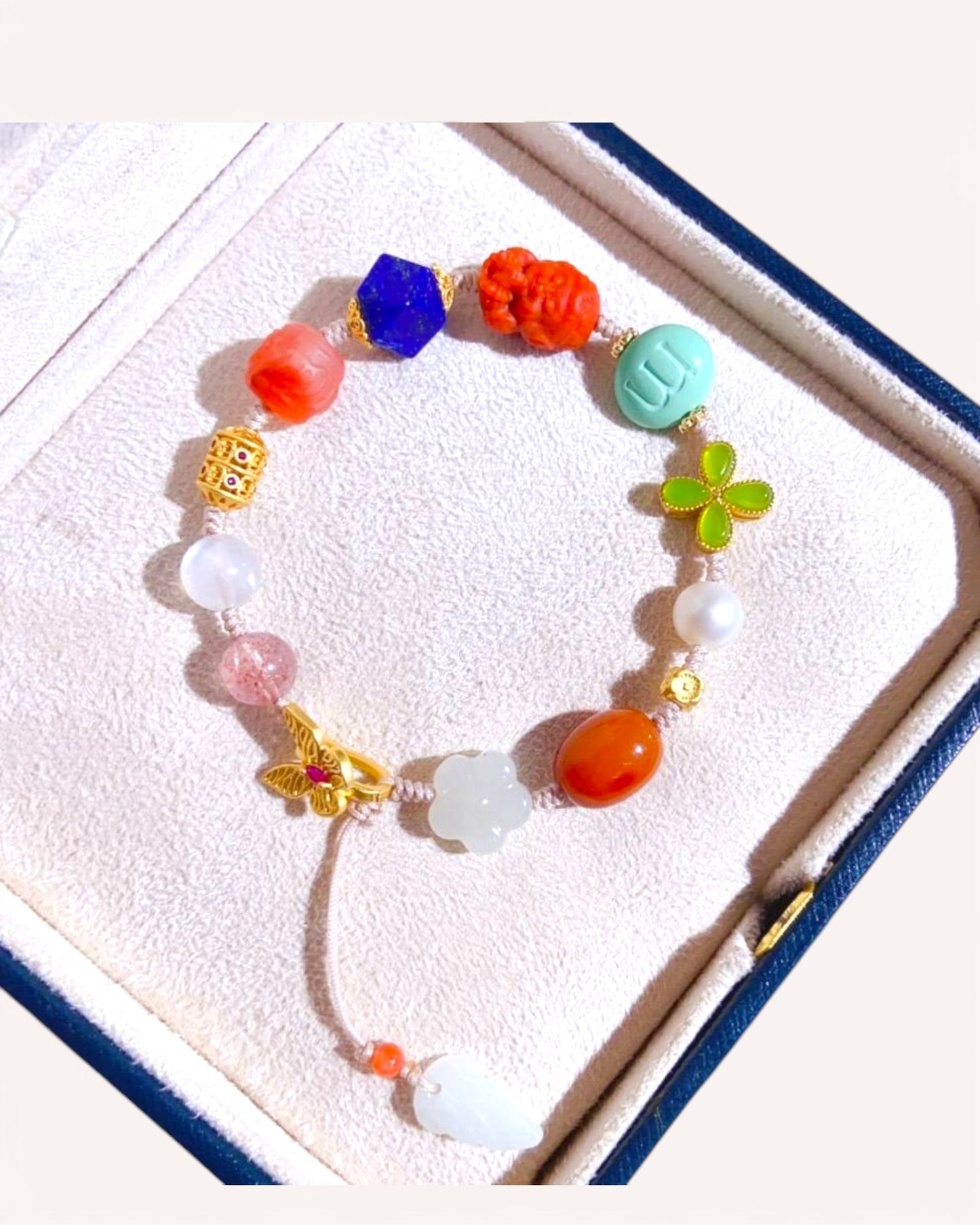 Colorful multi-gemstone mantra bracelet with jade, lapis lazuli, and red agate for spiritual protection and prosperity