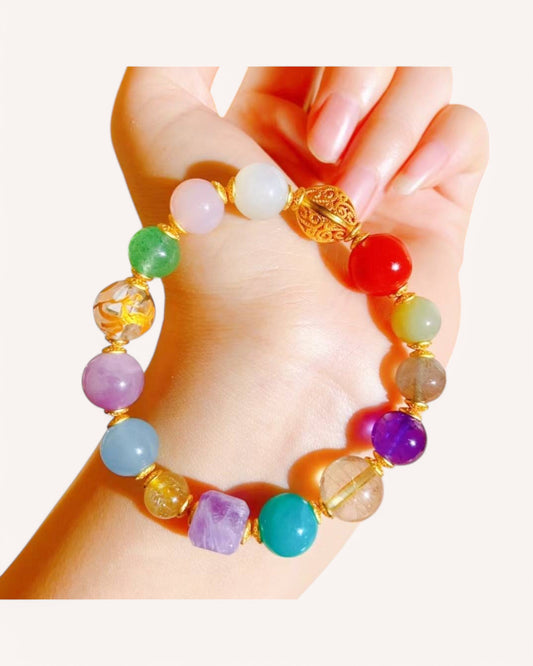 Person wearing multi-crystal bracelet featuring Amethyst, Red Agate, and White Quartz for clarity, protection, and inner peace