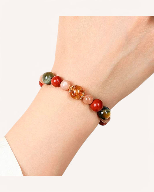 Model wearing Obsidian and Citrine bracelet for emotional stability, protection and abundance