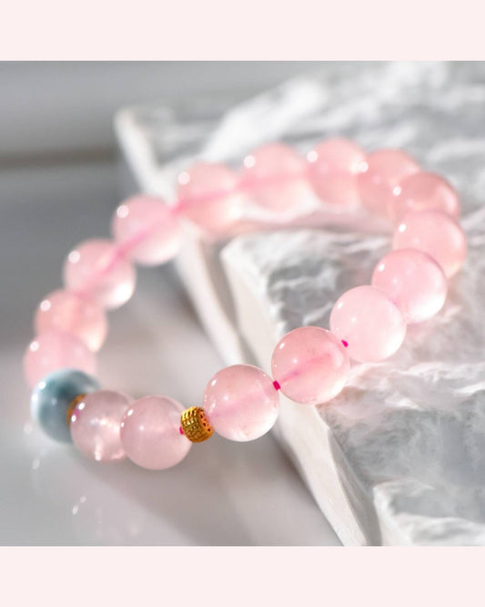 Rose Quartz and Ocean Jasper healing bracelet displayed on white marble background, promoting emotional balance, tranquility, and love energy.