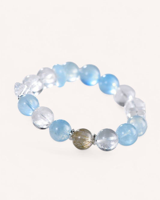 Elegant Tranquility & Prosperity Bracelet featuring Aquamarine, White Quartz, and Rutilated Quartz. A perfect accessory for calmness, confidence, and abundance manifestation.