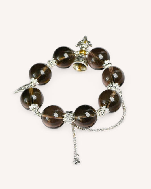 Full layout of the Smoky Quartz Healing Bracelet highlighting its large beads, spiritual charm, and elegant silver design for balance and strength.