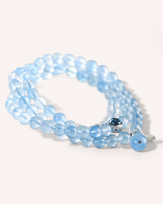 Side view of layered aquamarine bracelet promoting spiritual balance and stress relief