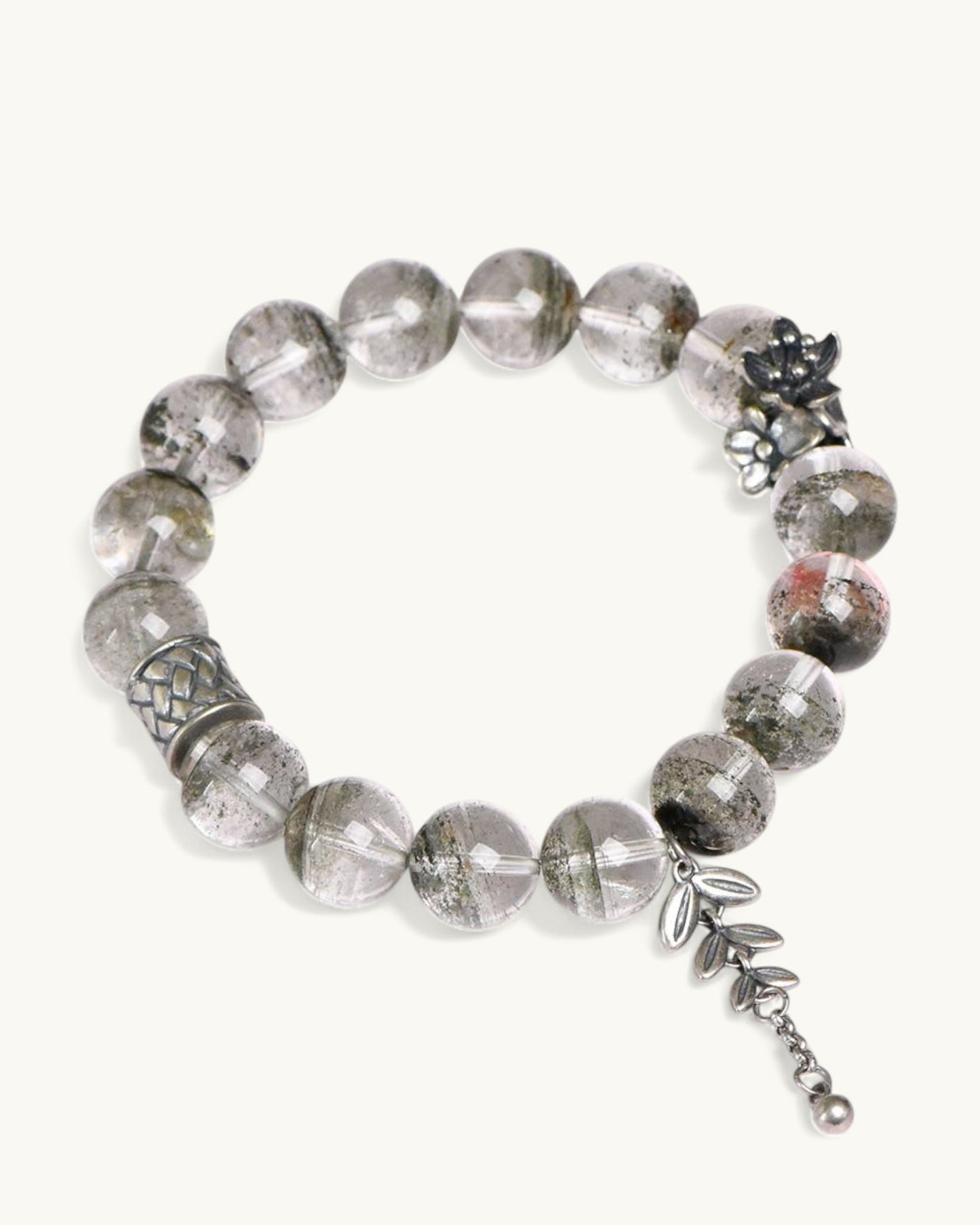 Chakra-aligned Green Phantom Quartz bracelet with detailed silver moon charm for transformation and grounding.