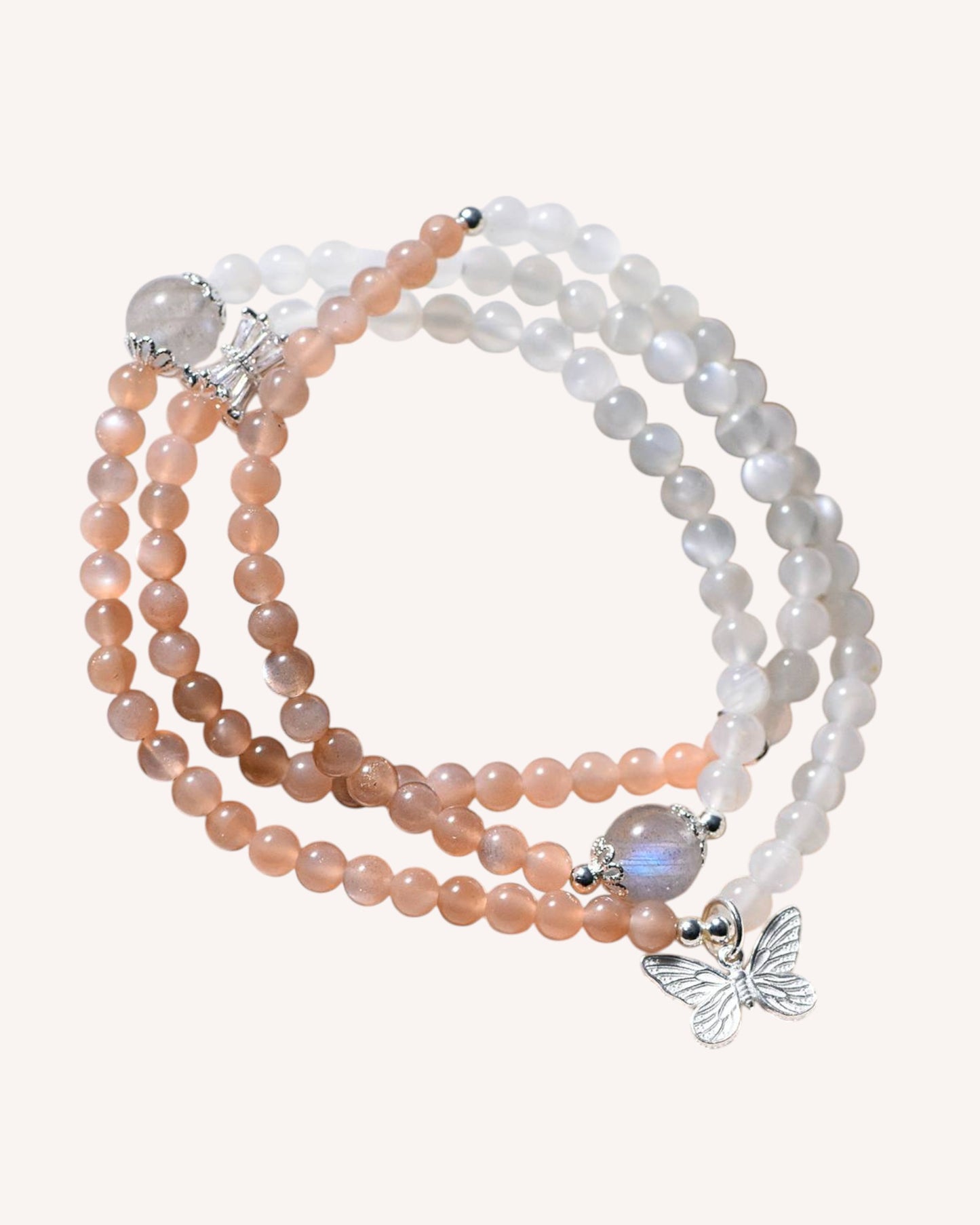 Elegant triple moonstone bracelet with orange, white, and gray stones for spiritual growth, emotional healing, and divine feminine power